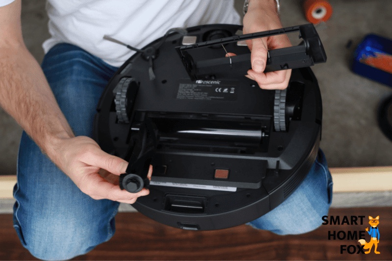 Taking out the main brush of the Proscenic M7 Pro